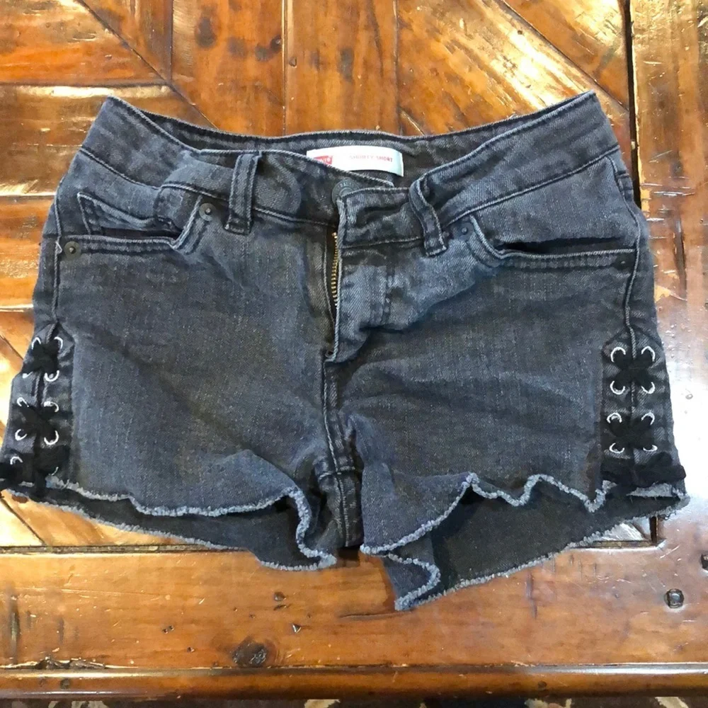 Levi’s girls black denim shorty shorts with lace up sides